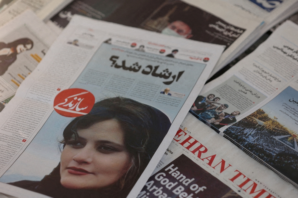 A newspaper with a cover picture of Mahsa Amini, a woman who died after being arrested by Iranian morality police is seen in Tehran, Iran, on September 18, 2022.  File Photo / Reuters