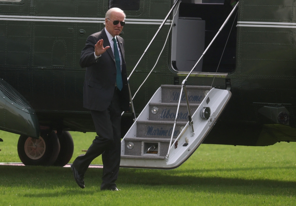 US President Joe Biden walks across the South Lawn after arriving on Marine One from Delaware at the White House in Washington, US, on October 17, 2022. REUTERS/Leah Millis