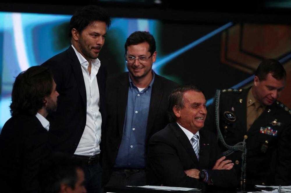 Brazil's President and candidate for re-election Jair Bolsonaro attends a debate ahead of the runoff election, in Osasco, Brazil, on October 21, 2022. REUTERS/Carla Carniel