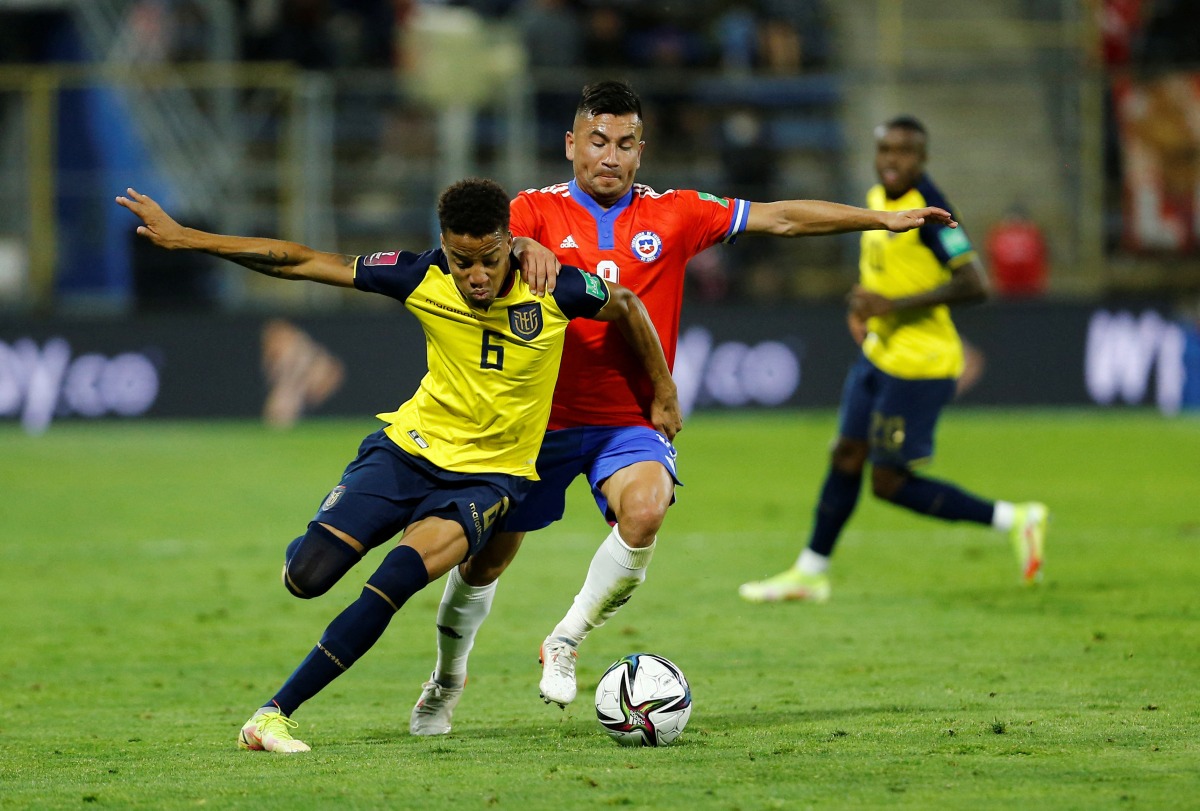 Ecuador's Byron Castillo in action with Chile's Jean Meneses during their World Cup South American Qualifiers at the Estadio San Carlos de Apoquindo, Santiago, Chile, on November 16, 2021. File Photo / Reuters