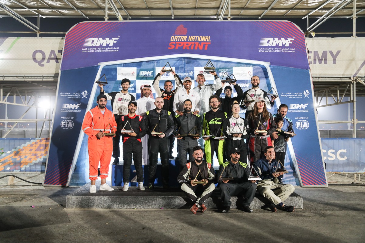 The podium winners of the sixth and final round of the Qatar National Sprint with Qatar Motor & Motocycle Federation officials.