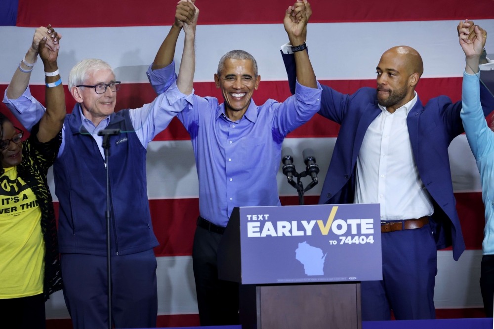 Former US President Barack Obama stumps for Wisconsin Governor Tony Evers (left) and Democratic candidate for US senate in Wisconsin Mandela Barnes in Milwaukee, Wisconsin, on October 29, 2022. Evers and Barnes, who currently serves as the state's lieutenant governor, are both facing close mid-term races. Scott Olson/Getty Images/AFP