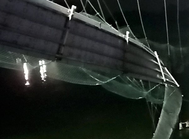 A view shows a damaged part of a suspension bridge after it collapsed in Morbi town in the western state of Gujarat, India, October 30, 2022. (REUTERS)
