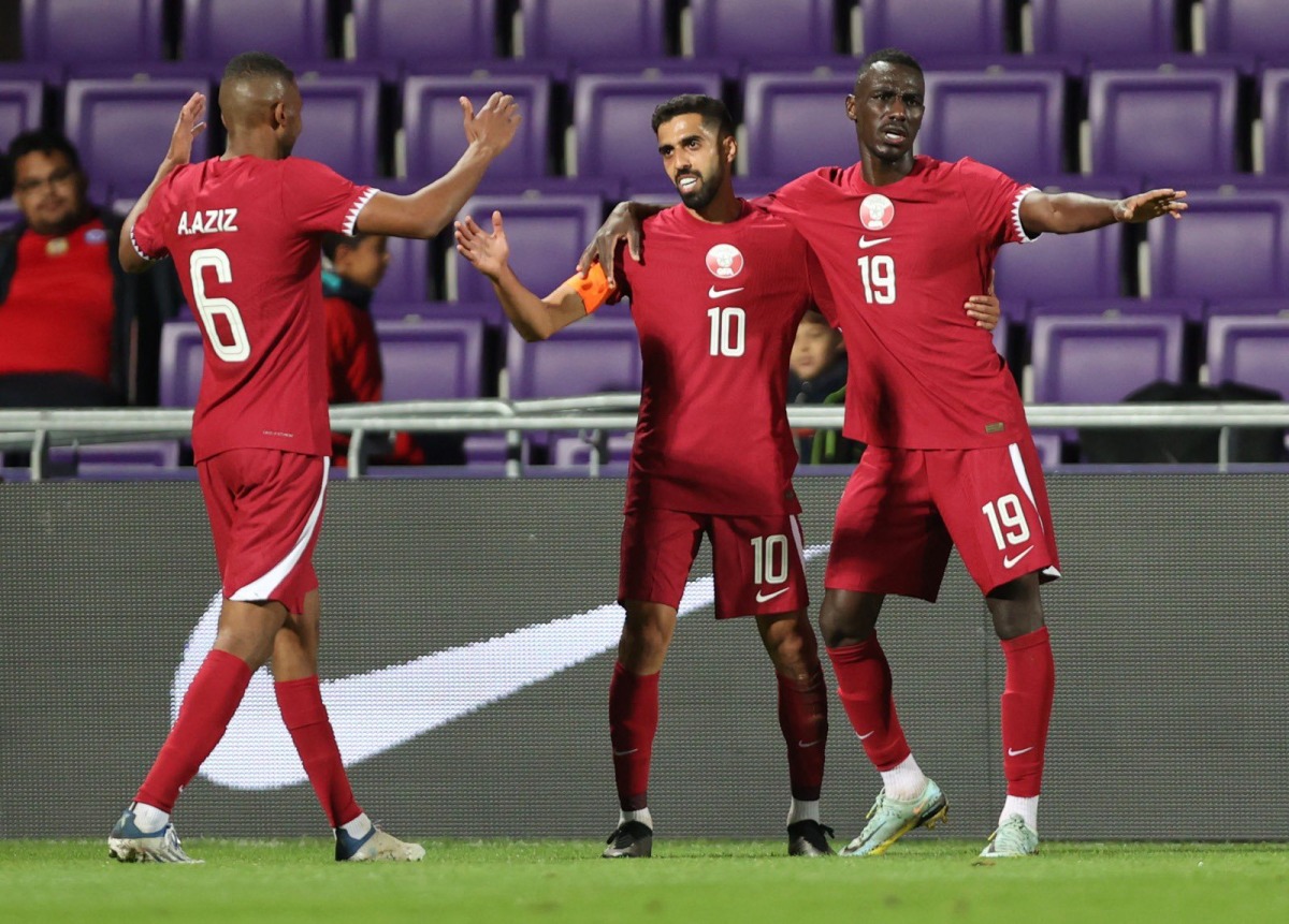 Qatar players celebrate during a match, in this file photo.