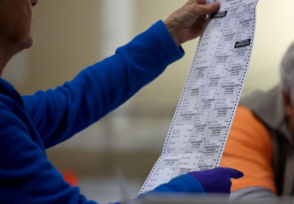 Ballots are processed by election workers at the Clark County Election Department during the ongoing election process on November 10, 2022 in North Las Vegas, Nevada. Two days after midterm elections Nevada election officials continue counting votes in state races. Mario Tama/Getty Images/AFP