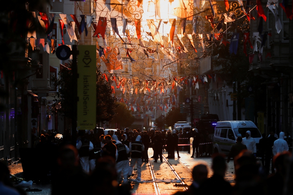 Police and emergency service members work at the scene after an explosion on busy pedestrian Istiklal street in Istanbul, Turkey, November 13, 2022. REUTERS/Kemal Aslan