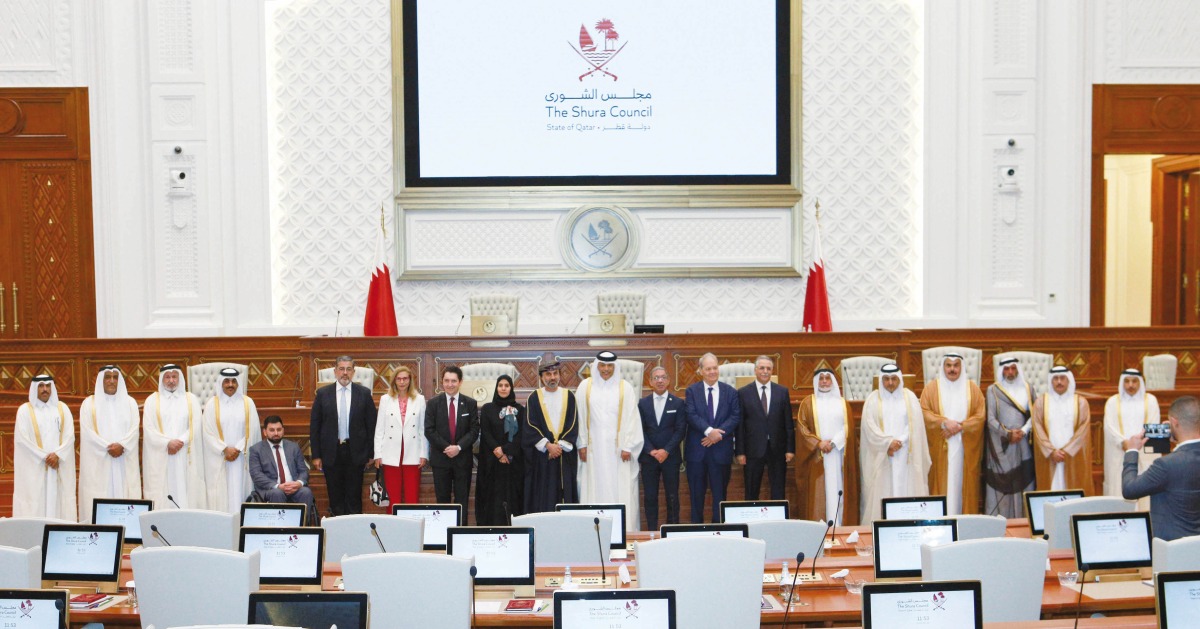 Speaker of the Shura Council H E Hassan bin Abdullah Al Ghanim with the visiting speakers of parliamentary councils and officials, yesterday.