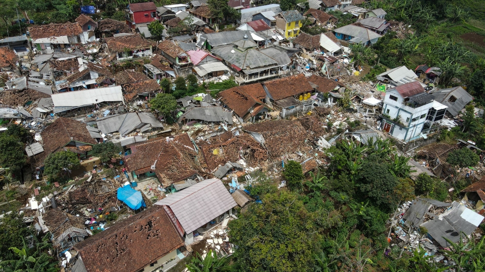 An aerial view of badly damaged houses following Monday's earthquake in Cianjur, November 23, 2022, in this photo taken by Antara Foto. Antara Foto/Raisan Al Farisi via Reuters 