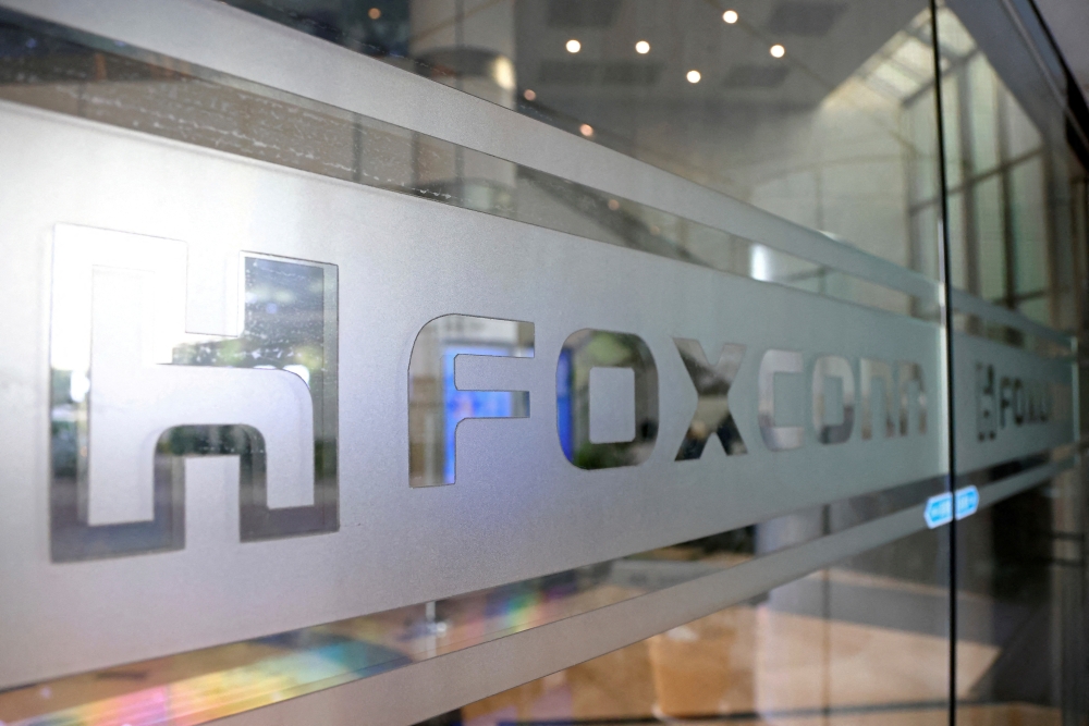 The Foxconn logo is seen on a glass door at its office building in Taipei, Taiwan November 12, 2020. Reuters/Ann Wang/File Photo