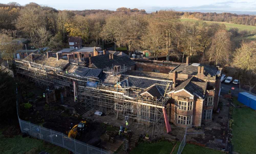 An aerial view shows Hopwood Hall, the ancestral home of US film producer Hopwood DePree, that dates from the 15th century, which he is in the process of restoring, in Middleton, northern England on November 28, 2022. Photo by OLI SCARFF / AFP