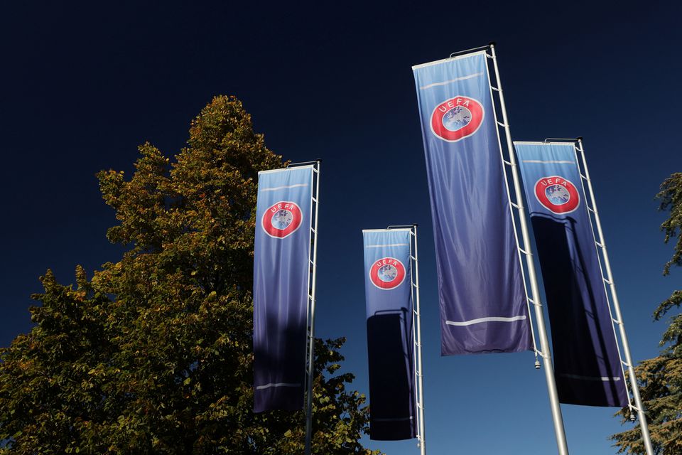 Flags with UEFA logo are seen outside of the Union of European Football Associations headquarters in Nyon, Switzerland, October 5, 2022. File Photo / Reuters