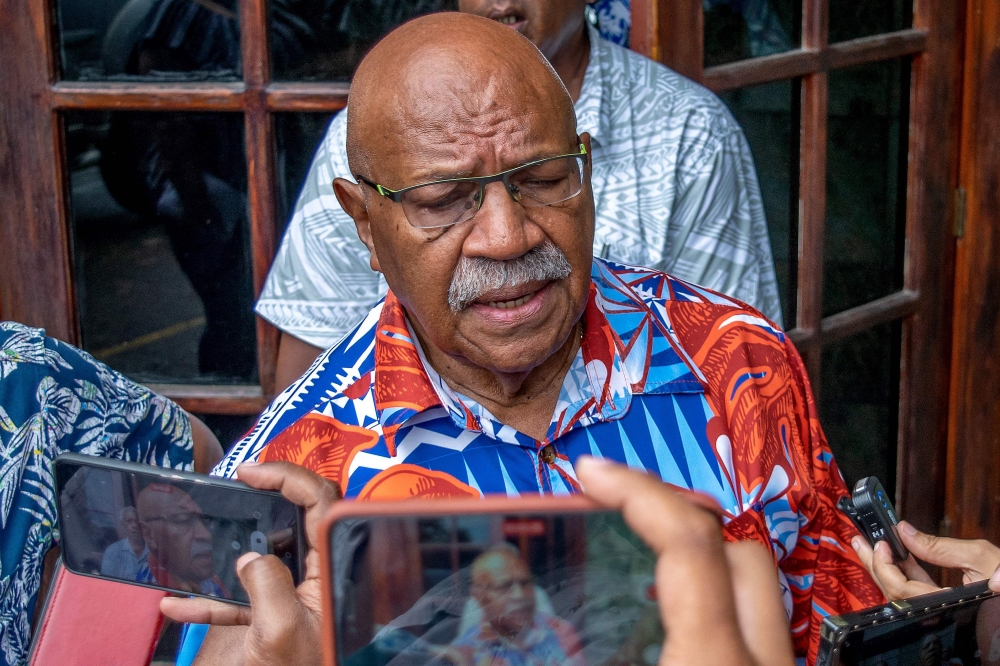 People's Alliance Party leader Sitiveni Rabuka speaks to media after a second round of negotiations with the leadership of the Social Democratic Liberal Party (SODELPA), in Suva on December 23, 2022. (Photo by Stringer / AFP)