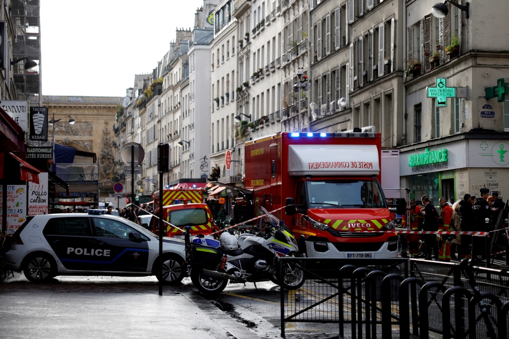 French police and firefighters secure a street after gunshots were fired, killing two people and injuring several, in a central district of Paris, France, December 23, 2022. Reuters/Sarah Meyssonnier/File Photo