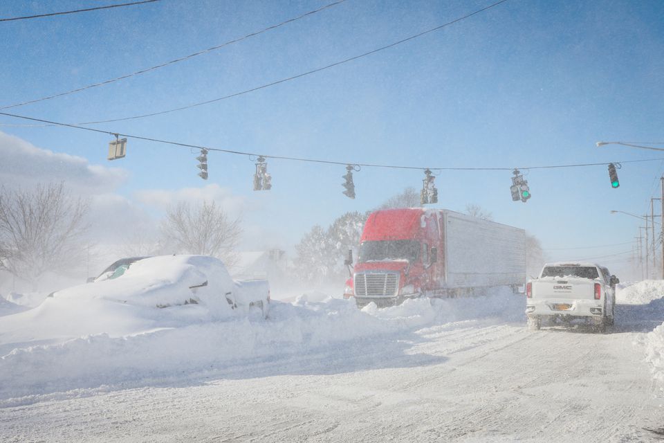 Vehicles are left stranded on the road following a winter storm that hit the Buffalo region on Main St. in Amherst, New York, US, December 25, 2022. REUTERS/Brendan McDermid