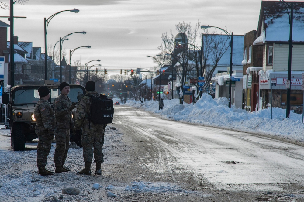 US National Guard assist in recovery efforts after a record winter storm in Buffalo, New York, on December 28, 2022.  (Photo by Jorge Uzon / AFP)