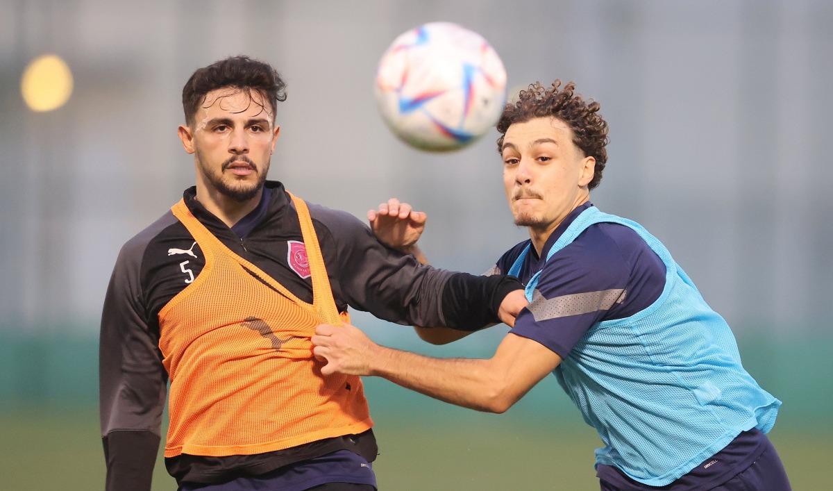 Al Duhail's Bassam Al Rawi (left) in action with a team-mate during a training session.