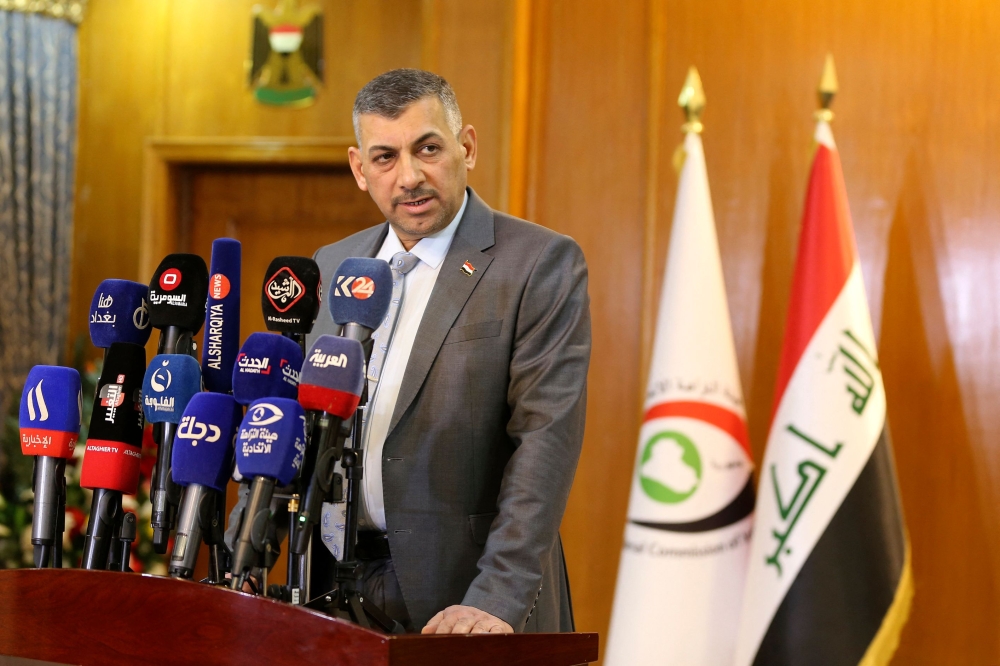 Judge Haider Hanoun, head of the Federal Authority of Integrity, speaks to the press in Baghdad on January 3, 2023, to announce the recovery of four billion Iraqi dinars, the equivaliant of $2.6 million, reportedly part of the $2.5 billion of government funds fraudulently stolen from the tax authorities. (Photo by Sabah ARAR / AFP)