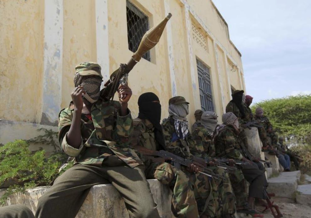 File photo: Al Shabaab soldiers sit outside a building during patrol along the streets of Dayniile district in Southern Mogadishu, March 5, 2012. (REUTERS/Feisal Omar)