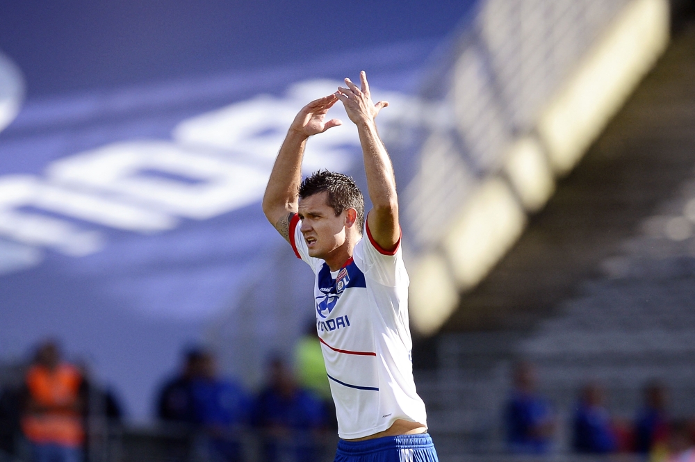 In this file photo taken on September 16, 2012, Lyon's Croatian defender Dejan Lovren celebrates after scoring a goal during the French L1 football match Olympique Lyonnais (OL) vs AC Ajaccio (ACA), at the Gerland Stadium in Lyon. (Photo by JEFF PACHOUD / AFP)
