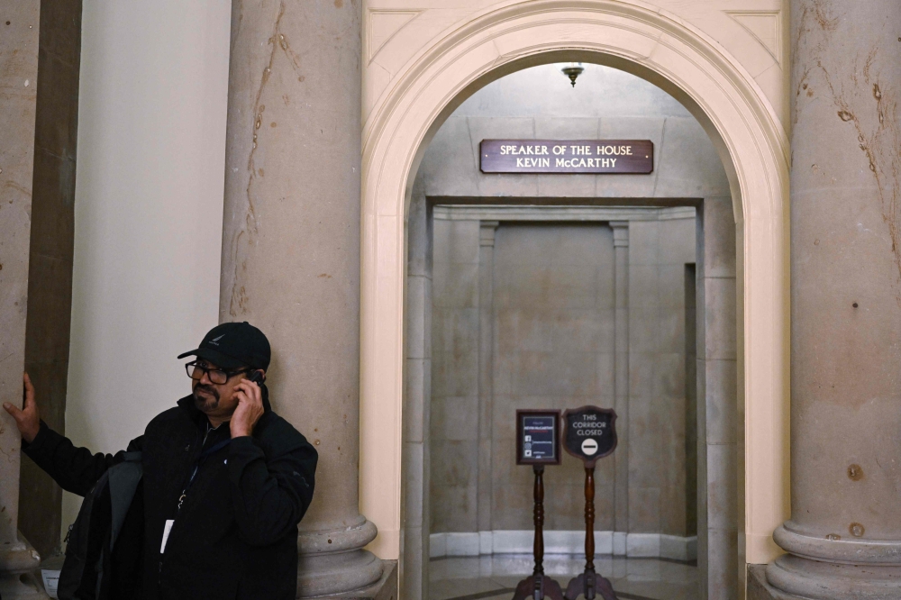 A sign with the name of newly-elected House Speaker Kevin McCarthy is seen outside his suite of offices in the US Capitol in Washington, DC on January 9, 2023. (Photo by Mandel NGAN / AFP)