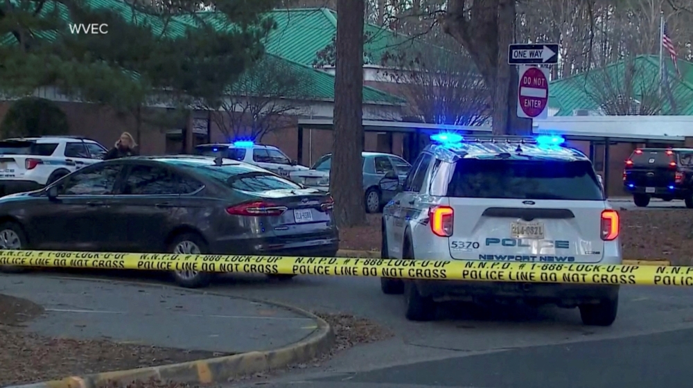 Police vehicles are seen parked outside Richneck Elementary School, where according to the police, a six-year-old boy shot and wounded a teacher, in Newport News, Virginia, U.S., January 6, 2023, in this screen grab from a handout video. WVEC via ABC/Handout via REUTERS