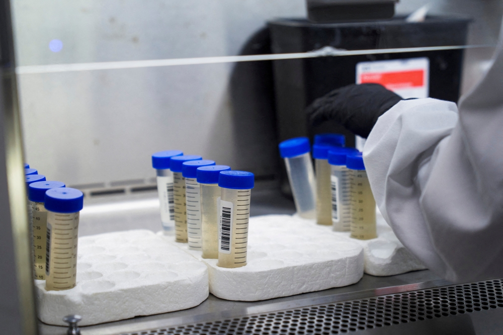 A lab technician tests wastewater samples from around the United States for the coronavirus disease (COVID-19) at the Biobot Analytics, in Cambridge, Massachusetts, US, on February 22, 2022. File Photo / Reuters
 