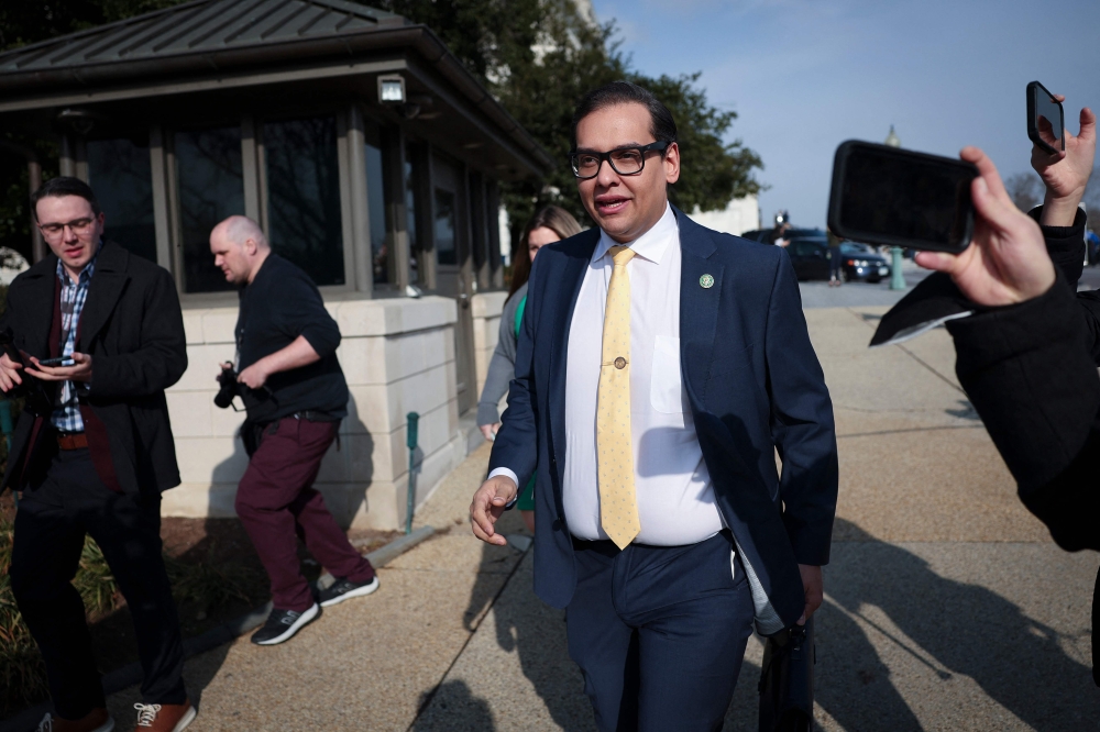 Rep. George Santos leaves the US Capitol on January 12, 2023 in Washington, DC. The Nassau County party chairman, Joseph G. Cairo Jr. and other New York Republican officials called on Santos to resign as investigations grow into his finances, campaign spending and false statements on the campaign trail. Santos announced in a tweet that he would not resign. Win McNamee/Getty Images/AFP 