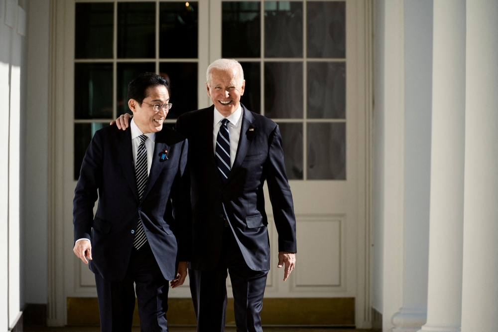 US President Joe Biden and Japanese Prime Minister Fumio Kishida on their way to the Oval Office at the White House, in Washington, US, January 13, 2023. (T.J. Kirkpatrick/Pool via REUTERS)