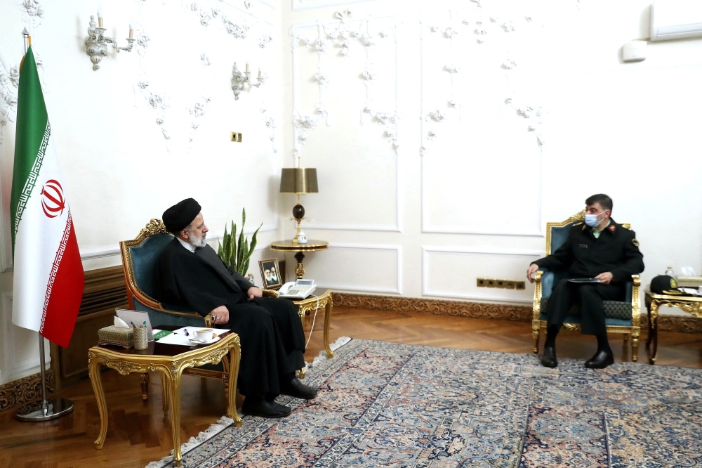 Iranian President Ebrahim Raisi meets with the new chief commander of the Iranian police force, Ahmad-Reza Radan in Tehran, Iran, January 14, 2023. Presidential Website/WANA (West Asia News Agency)/Handout via REUTERS
