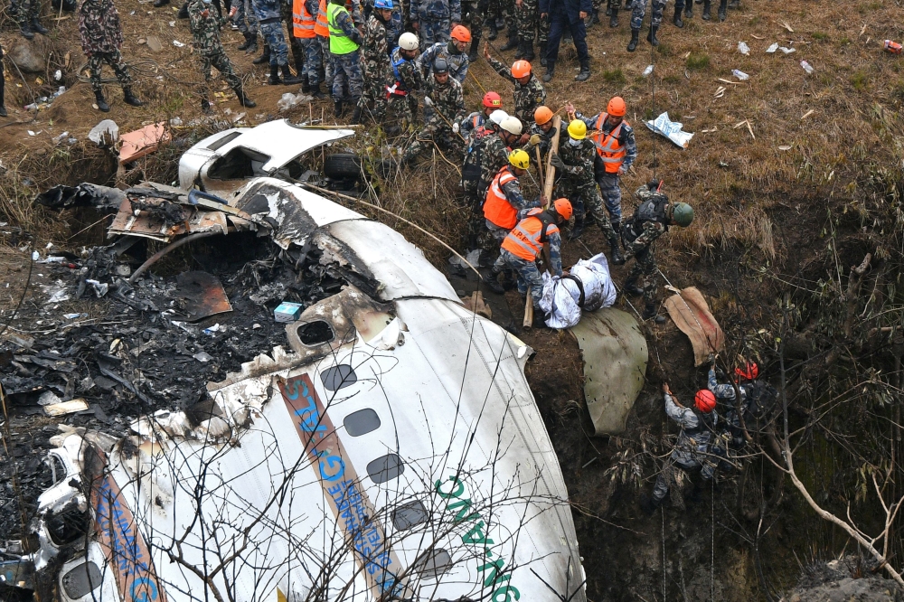 Nepal observed a day of mourning on January 16 for the victims of the nation's deadliest aviation disaster in three decades, with 67 people confirmed killed in the plane crash. (Photo by PRAKASH MATHEMA / AFP)