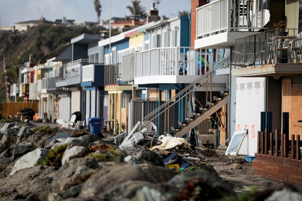 Houses along Beach Dr. in Seacliff that were damaged by flooding, in a region saturated after three weeks of storms, are seen in Aptos, California, U.S. January 16, 2023. REUTERS/Daniel Dreifuss
