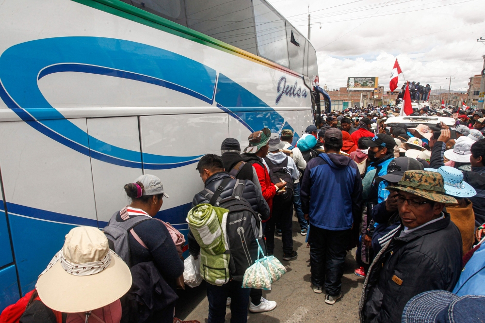 Demonstrators prepare to depart to Lima to protest against the government of Peruvian President Dina Boluarte in the city of Ilave, Puno, southern Peru on January 17, 2023.  (Photo by Juan Carlos CISNEROS / AFP)