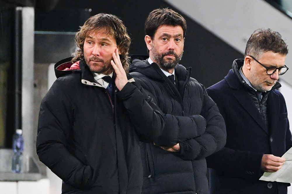 In this file photo taken on January 07, 2023 Juventus' outgoing President Andrea Agnelli (centre) and Juventus' outgoing vice-president Pavel Nedved (left) attend the Italian Serie A match between Juventus and Udinese on January 7, 2023 at the Juventus stadium in Turin. (Photo by Isabella BONOTTO / AFP)
