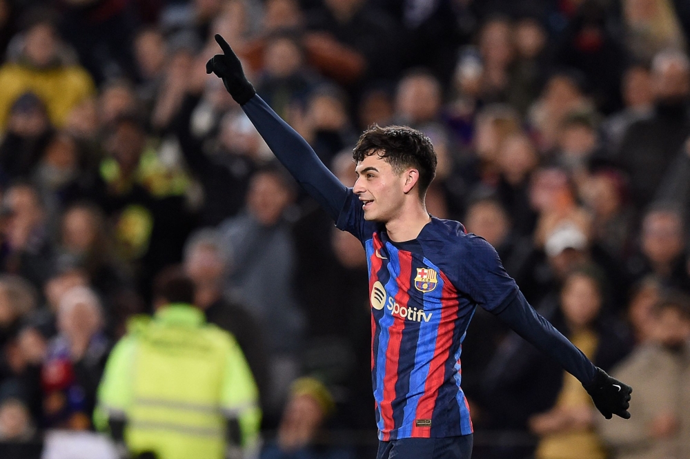 Barcelona's Spanish midfielder Pedri celebrates after scoring his team's first goal during the Spanish league football match between FC Barcelona and Getafe CF at the Camp Nou stadium in Barcelona, on January 22, 2023. (Photo by Josep LAGO / AFP)