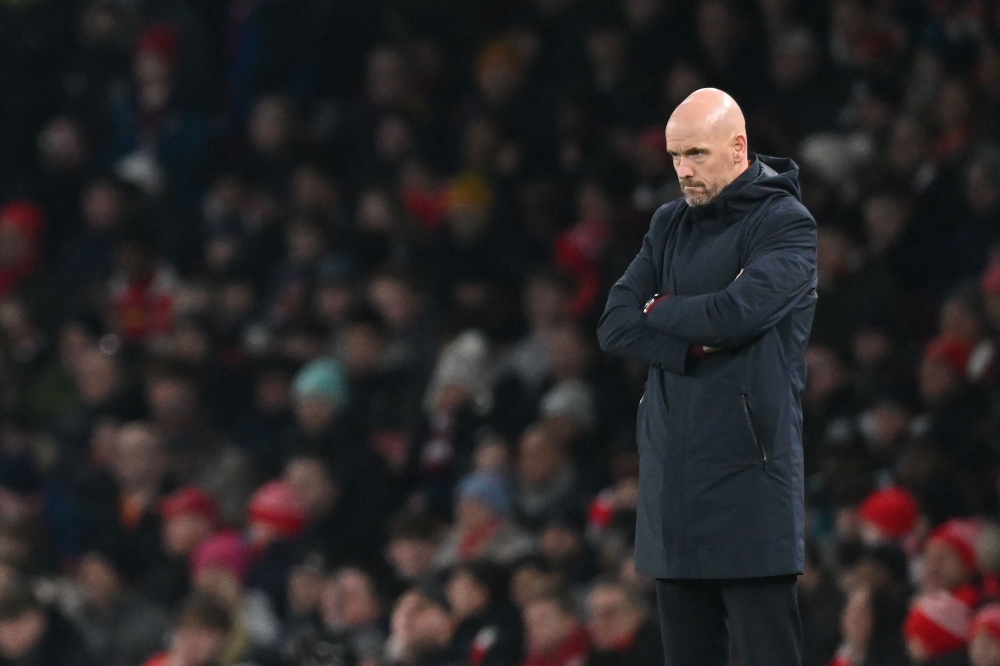 Manchester United's Dutch manager Erik ten Hag looks on during the English Premier League football match between Arsenal and Manchester United at the Emirates Stadium in London on January 22, 2023. (Photo by Glyn KIRK / AFP)