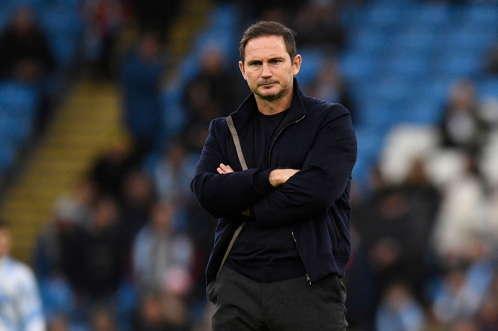 In this file photo taken on December 31, 2022 Everton's English manager Frank Lampard watches his players warm up ahead of the English Premier League football match between Manchester City and Everton at the Etihad Stadium in Manchester, north west England. (Photo by Oli SCARFF / AFP) 