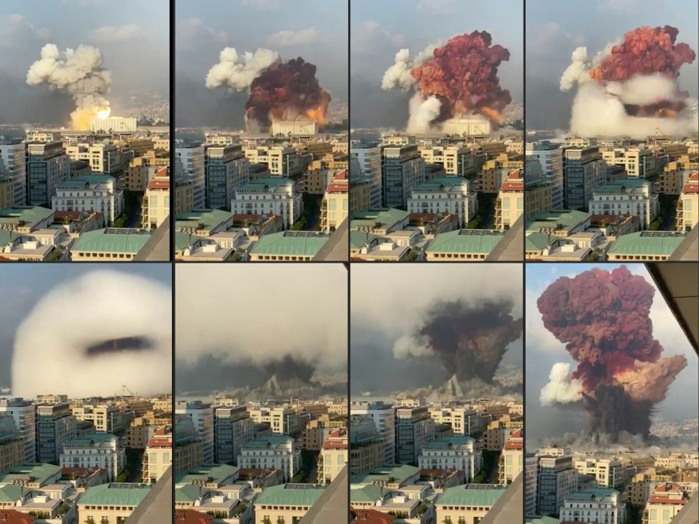 This file combination of pictures shows UGC footage filmed from an office building at the moment a massive explosion rocked Beirut the previous day shows a fireball exploding while smoke is billowing at the port of the Lebanese capital on August 4, 2020. (Photo by GABY SALEM/ESN / AFP)