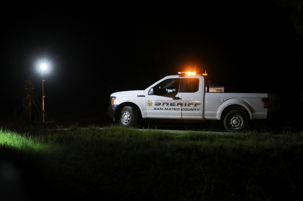 A San Mateo County Sheriff’s Office vehicle is seen near where victims were found dead in a shooting in Half Moon Bay, california, U.S. on January 24, 2023. Nathan Frandino/Reuters

