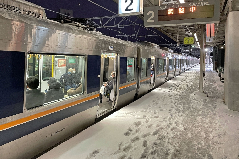A train is stranded at Nishioji station in Kyoto, Japan in this photo provided by Kyodo on January 25, 2023. Mandatory credit Kyodo/via REUTERS 