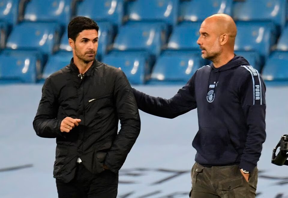 Manchester City manager Pep Guardiola and Arsenal manager Mikel Arteta react after a Premier League match at the Etihad Stadium, Manchester, Britain on June 17, 2020. File Photo / Reuters
