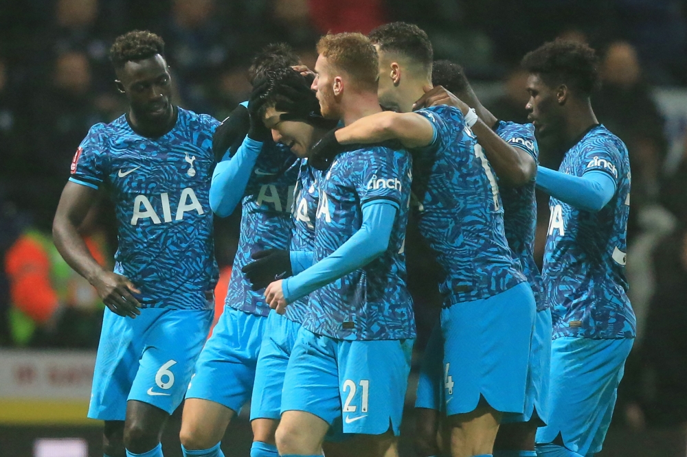 Tottenham Hotspur's striker Son Heung-Min (third left) celebrates with teammates after scoring the opening goal of the English FA Cup fourth round match between Preston North End and Tottenham Hotspur at Deepdale stadium in Preston, north-west England, on January 28, 2023. (Photo by Lindsey Parnaby / AFP)
