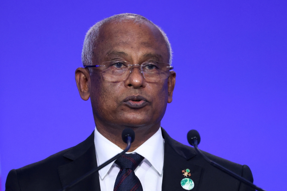 Maldives President Ibrahim Mohamed Solih speaks during the UN Climate Change Conference (COP26) in Glasgow, Scotland, Britain, November 1, 2021. FILE PHOTO: REUTERS/Yves Herman