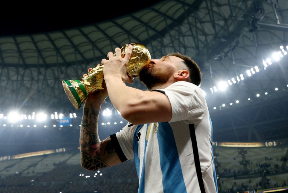 Argentina's Lionel Messi kisses the World Cup trophy as he celebrates after winning the FIFA World Cup Qatar 2022 tournament at the Lusail Stadium on December 18, 2022. (Reuters file photo)

