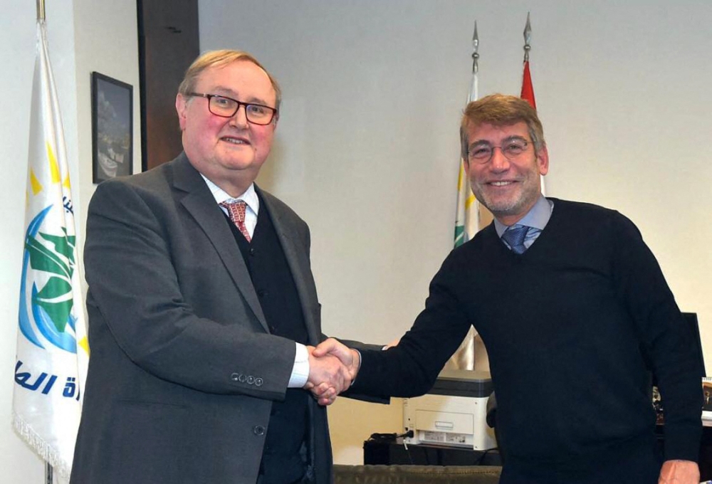 A handout picture provided by the Lebanese photo agency Dalati and Nohra shows Lebanon's caretaker Energy Minister Walid Fayad (right) meeting with French Envoy in charge of coordinating the international aid to Lebanon Pierre Duquesne in the capital Beirut on February 3, 2023. (Photo by DALATI AND NOHRA / AFP)