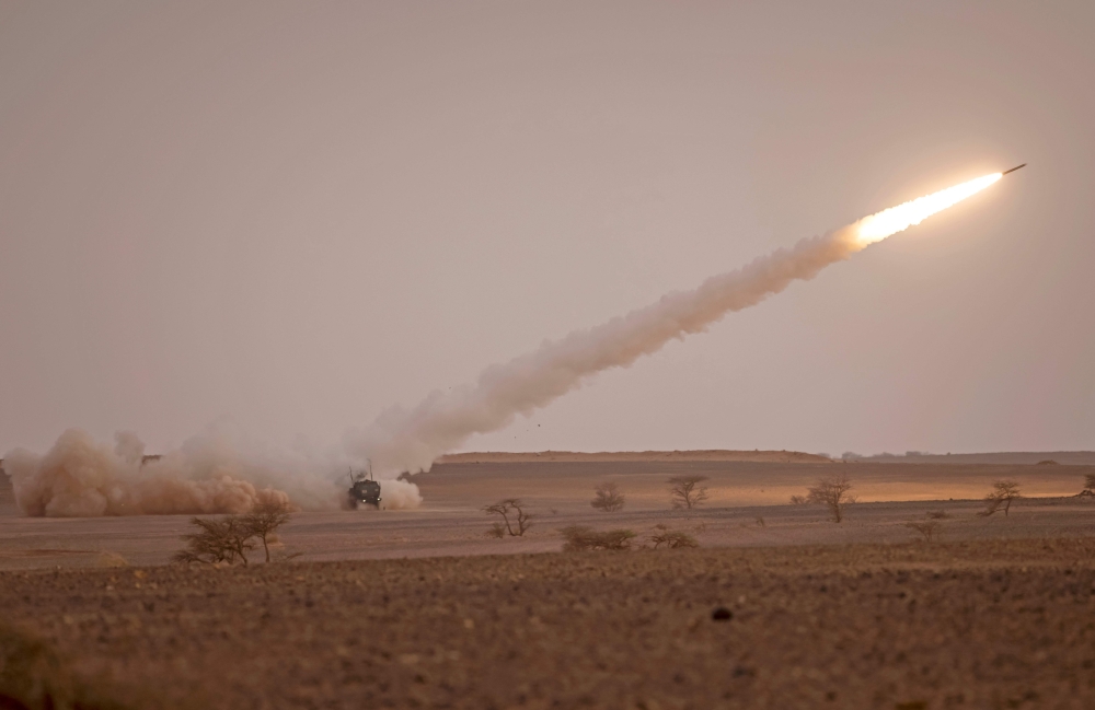 In this file photo taken on June 21, 2022, a US M142 High Mobility Artillery rocket System (HIMARS) fires salvoes during the 'African Lion' military exercise in the Grier Labouihi region of southeastern Morocco. (Photo by FADEL SENNA / AFP)