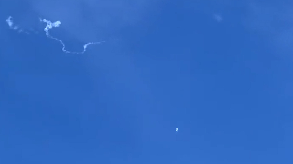 This still image taken from a cellphone video by Haley Walsh in Myrtle Beach, South Carolina, shows an alleged Chinese surveillance balloon after it was shot down on February 4, 2023. Photo by Haley WALSH / AFP