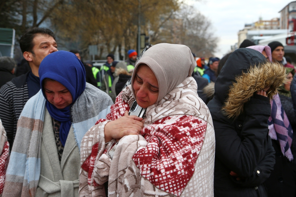 People react they wait near a search and rescue operation following an earthquake in Gaziantep, Turkey, February 7, 2023. (REUTERS/Cagla Gurdogan)
