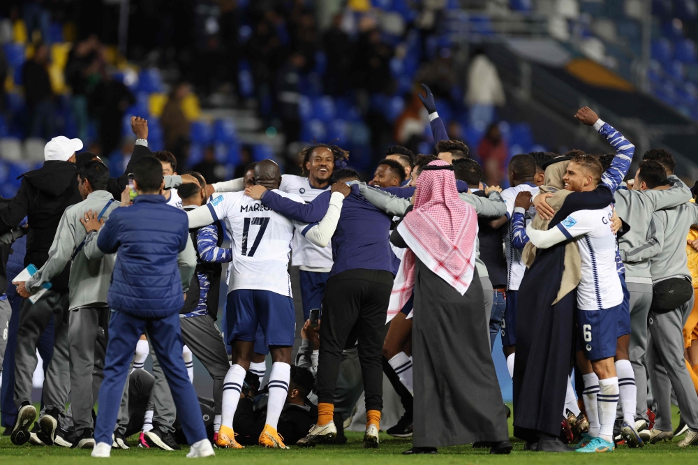 Hilal's players celebrate their victory in the FIFA Club World Cup semi-final football match between Brazil's Flamengo and Saudi Arabia's Al-Hilal at the Ibn Batouta Stadium in Tangier on February 7, 2023. (Photo by Fadel Senna / AFP)