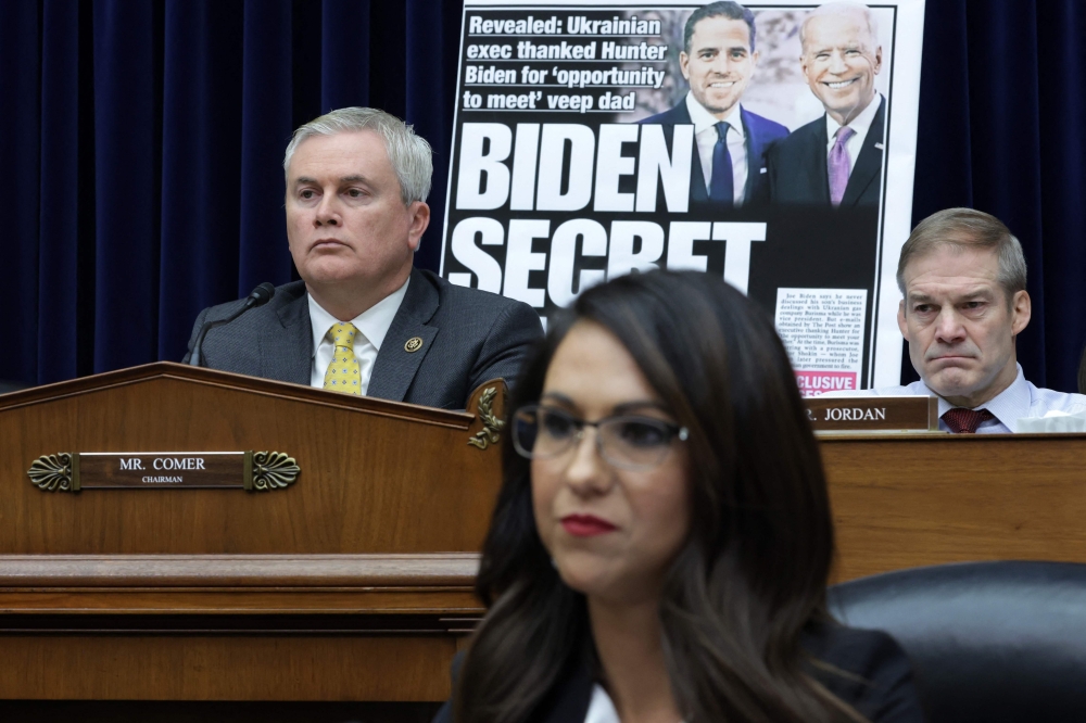 With a poster of a New York Post front page story about Hunter Biden's emails on display, Committee Chairman Rep. James Comer, Rep. Jim Jordon and Rep. Lauren Boebert listen during a hearing before the House Oversight and Accountability Committee at Rayburn House Office Building on Capitol Hill on February 8, 2023 in Washington, DC. Alex Wong/Getty Images/AFP