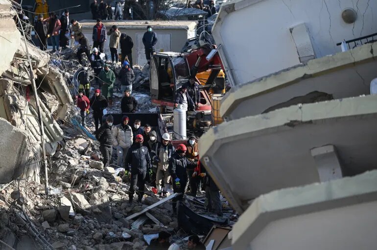 Rescue workers search collapsed buildings in Kahramanmaras, Turkey. Ozan Kose/AFP
